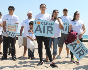 Students with clean air and climate action signs