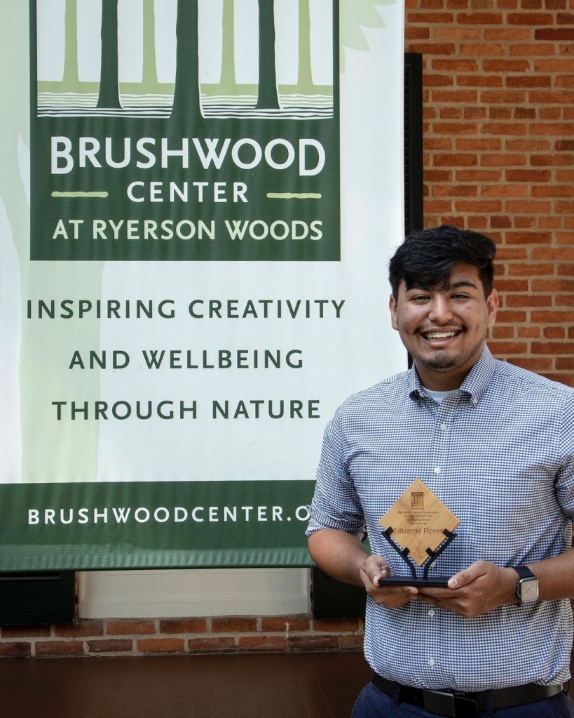 Man with award at Brushwood Center